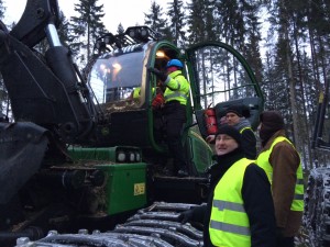 People exploring harvester cabin.