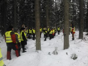 Excursion in snowy forest.