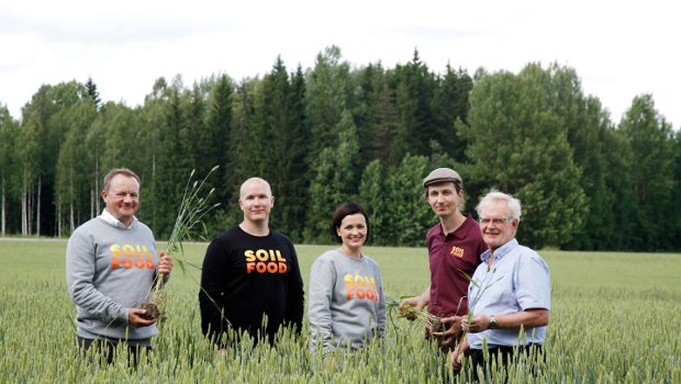 Soilfood's five workers in a field.