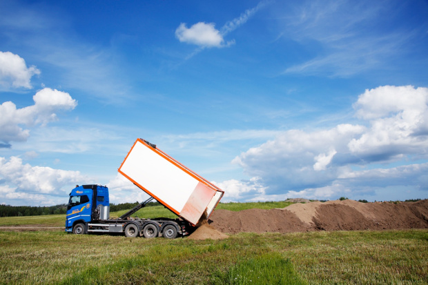 A van dropping land.