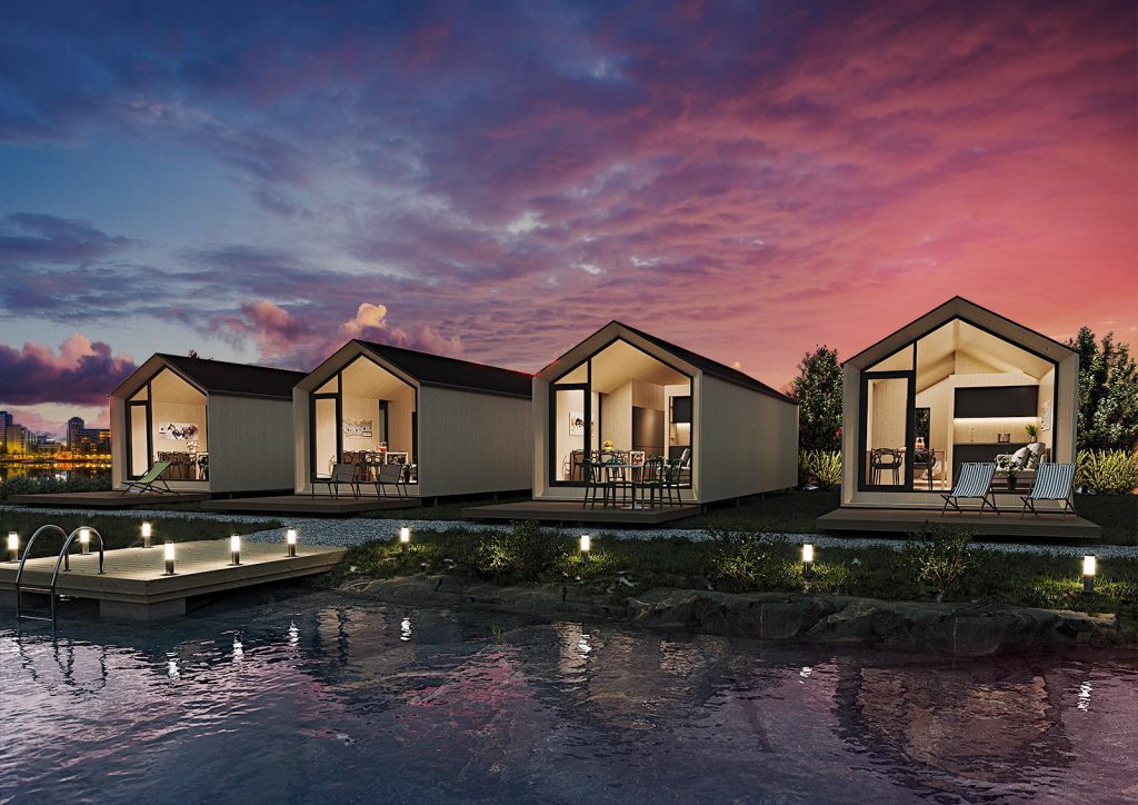 Accommodations next to lake in evening light.