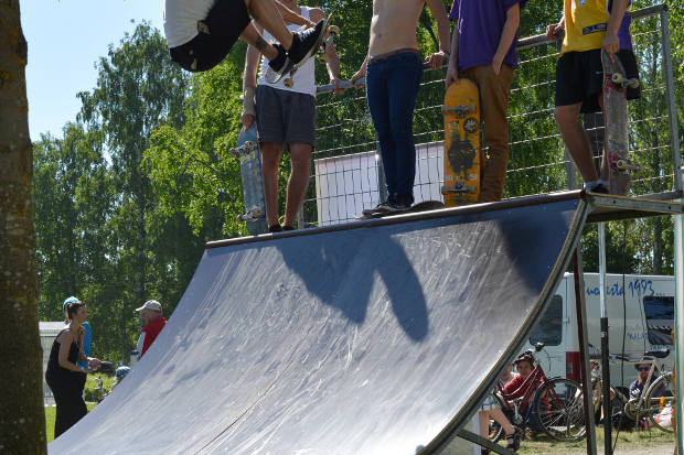 Skateboard ramp and skaters.