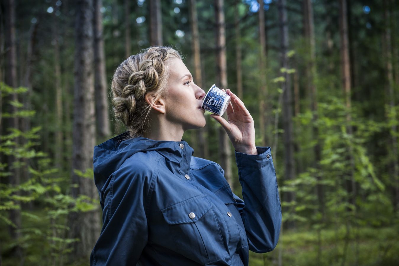 A woman drinking Roberts Berrie product.