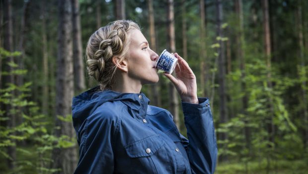 A woman drinking Roberts Berrie product.