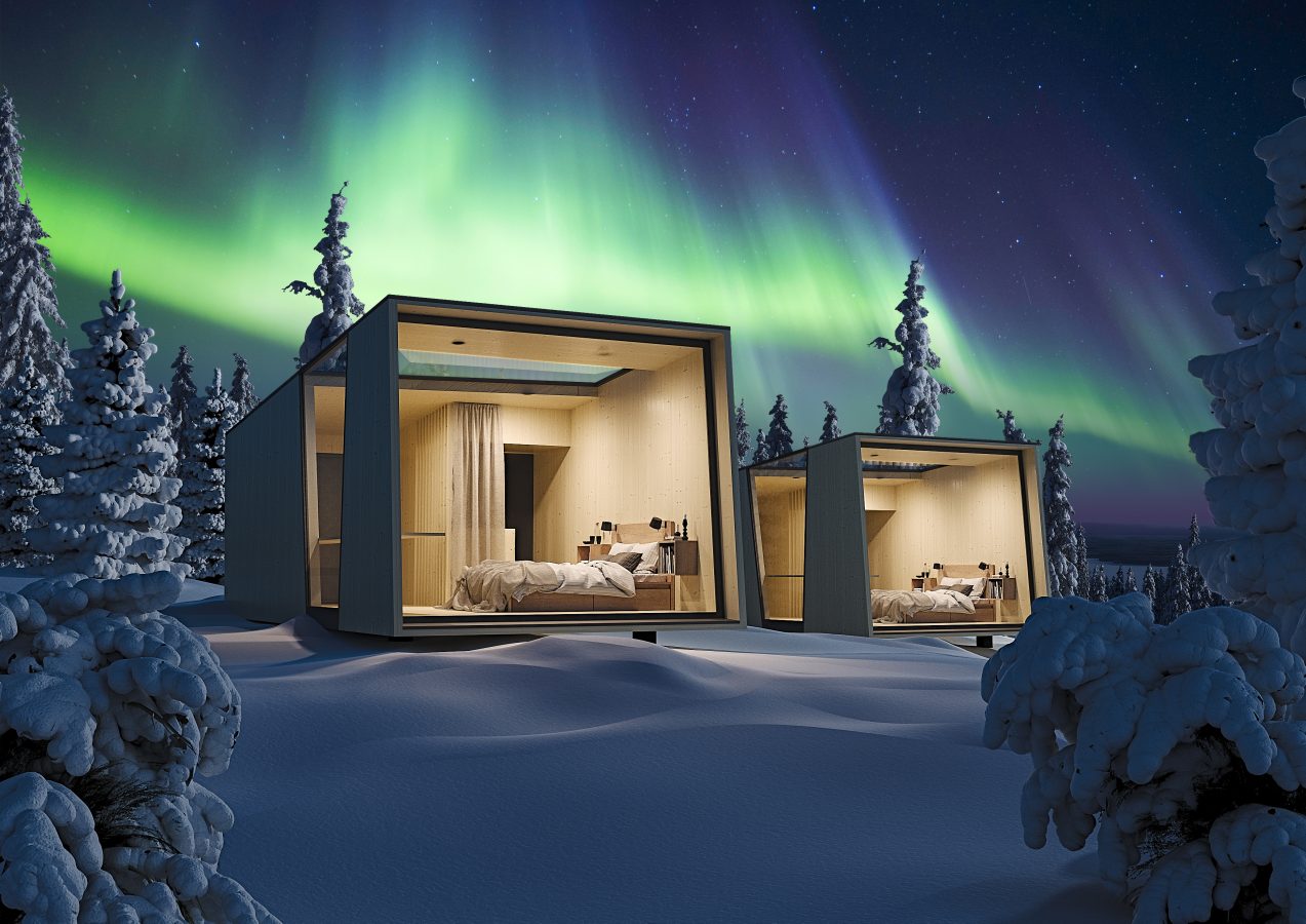 Accommodation in winter forest with northern lights in the background.